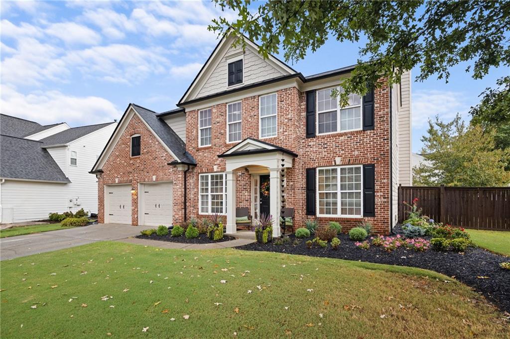 3910 Azurite Street Cumming, GA 30040 - Photo 1 of 1 front view of a house with a yard