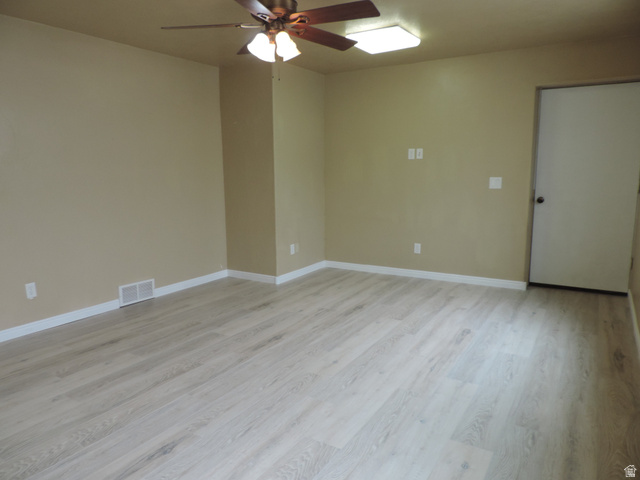 140 North 200 E Street Glenwood, UT 84730 - Photo 31 of 54 Empty room with ceiling fan and light wood finished floors