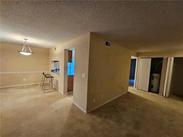 a view of an empty room with a fireplace