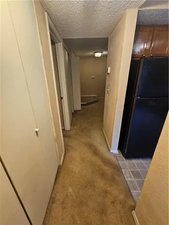 a view of an empty room with a fireplace