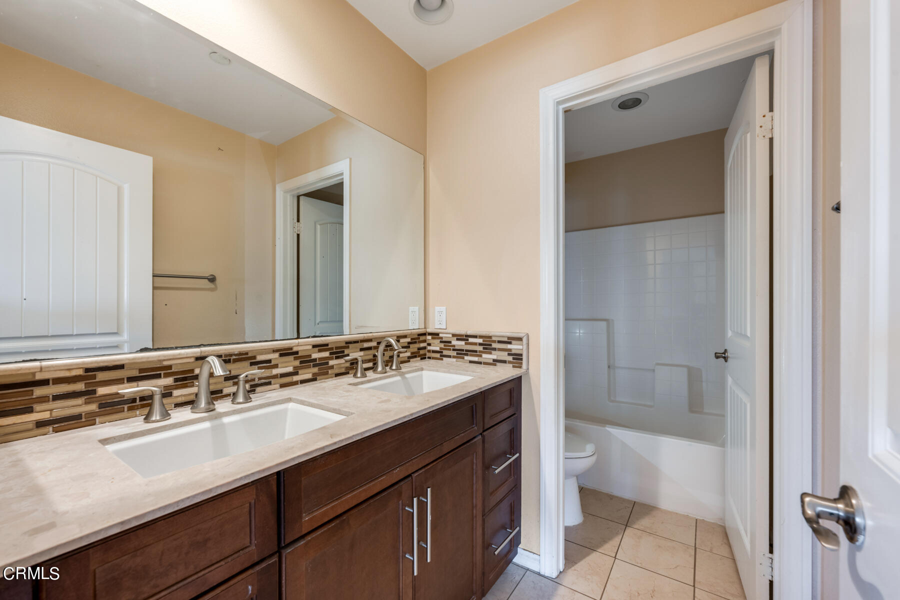7332 Blue Oak Road Riverside, CA 92507 - Photo 19 of 30 a bathroom with a sink and a mirror