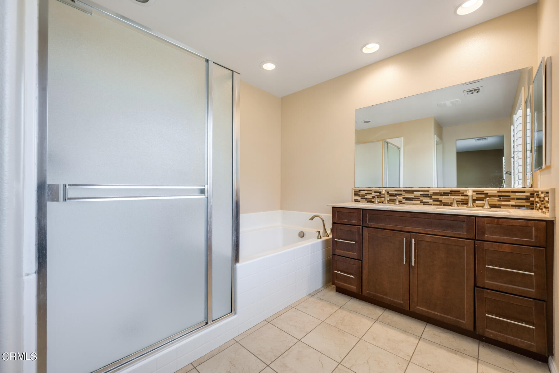 7332 Blue Oak Road Riverside, CA 92507 - Photo 24 of 30 a spacious bathroom with a bathtub sink and mirror