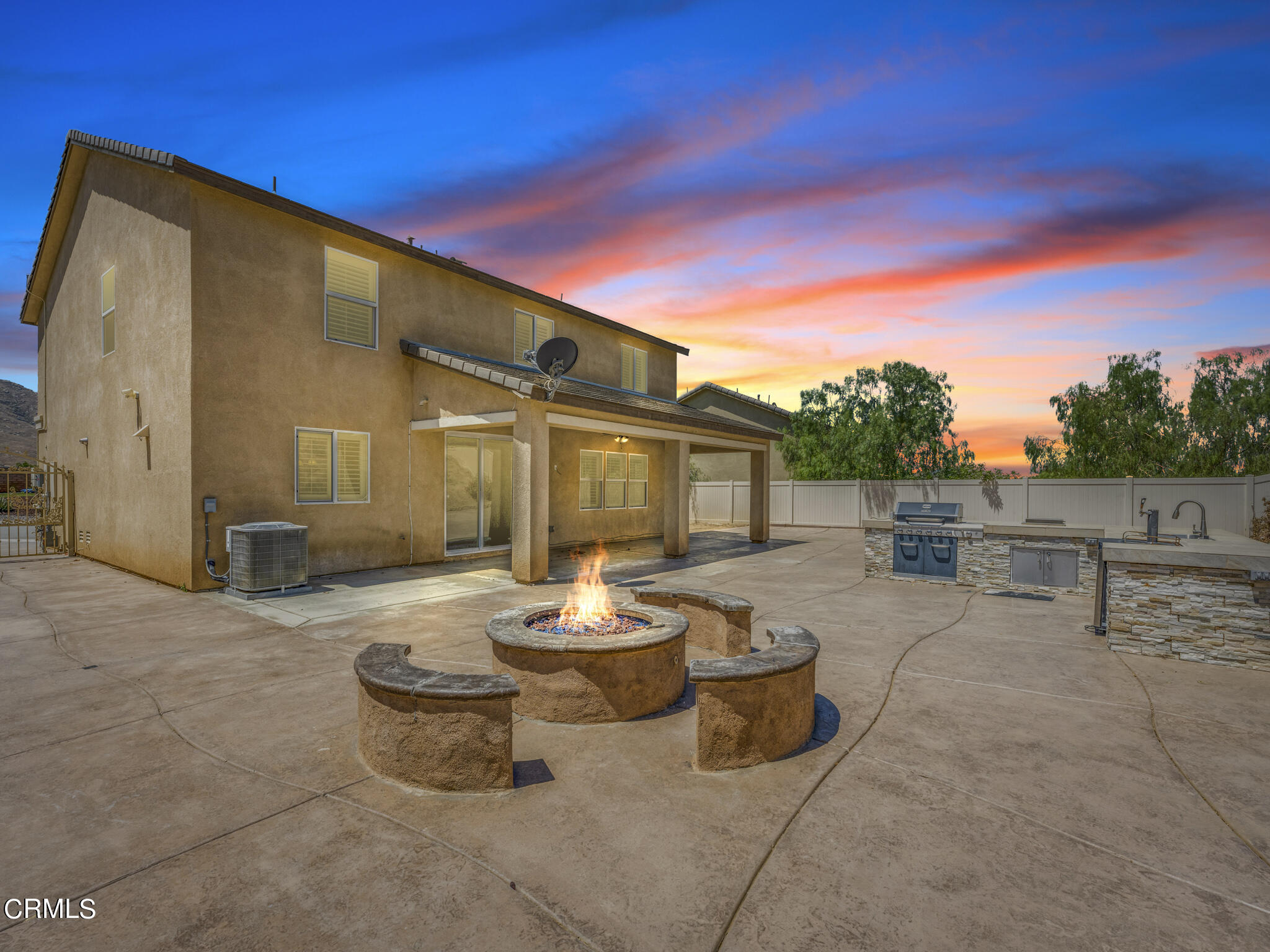 7332 Blue Oak Road Riverside, CA 92507 - Photo 3 of 30 a view of a patio with dining table and chairs with wooden fence