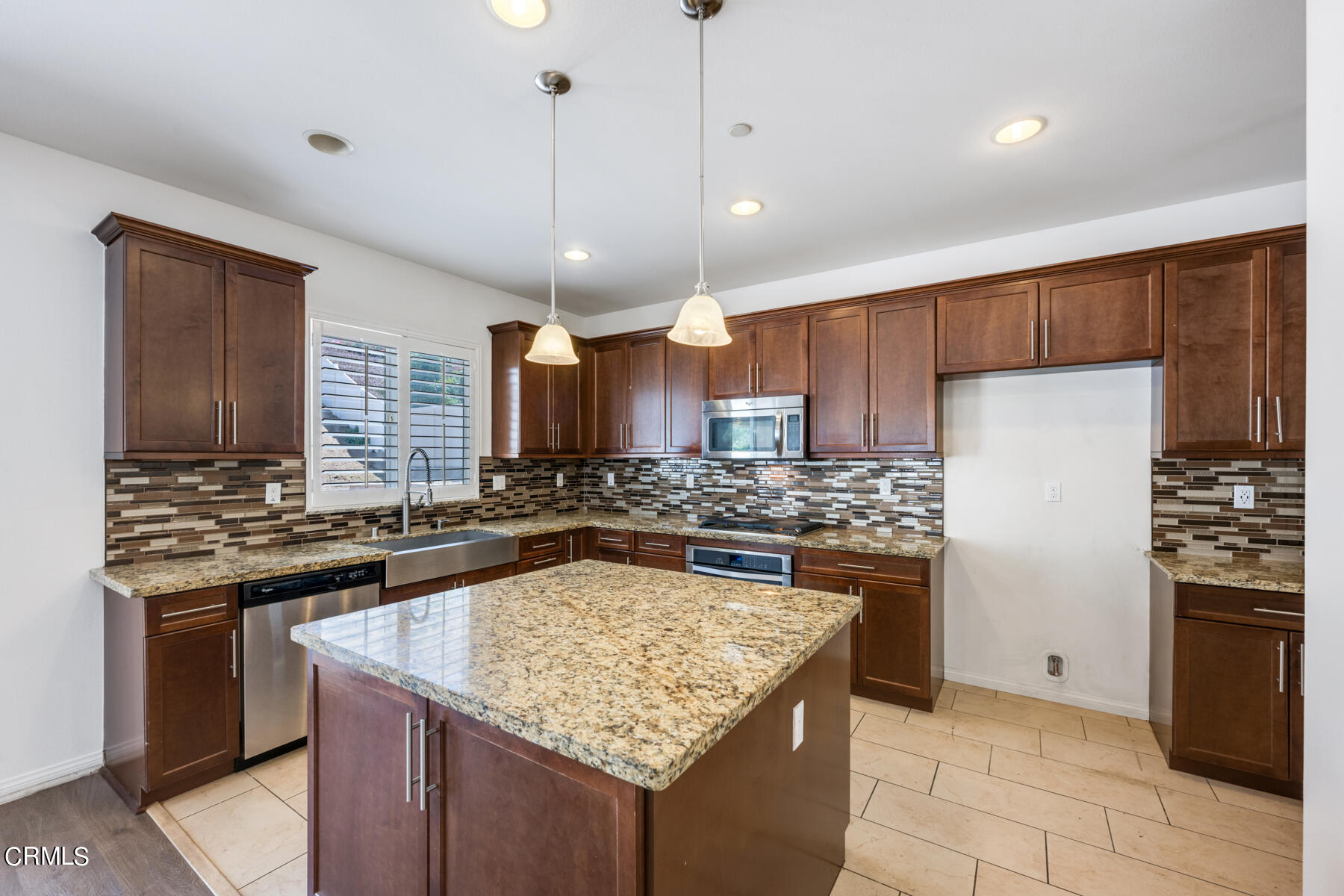 7332 Blue Oak Road Riverside, CA 92507 - Photo 5 of 30 a kitchen with stainless steel appliances granite countertop a stove sink and refrigerator