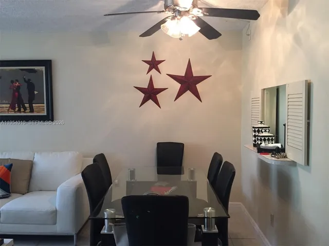 a view of a workspace with furniture and a couch