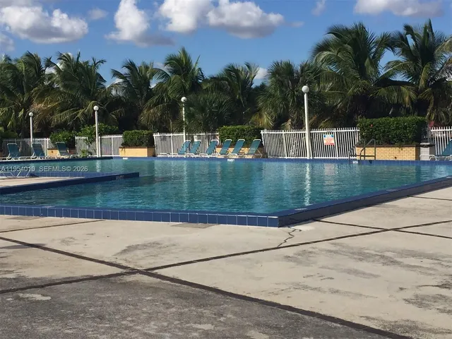 a view of a swimming pool with a patio