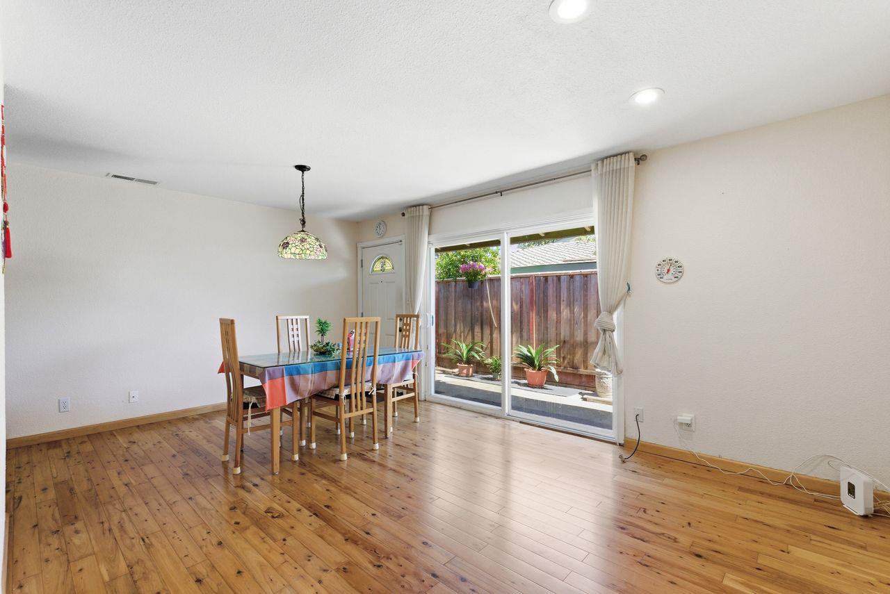 5561 Roundtree Common Fremont, CA 94538 - Photo 3 of 29 a view of a dining room with furniture window and wooden floor