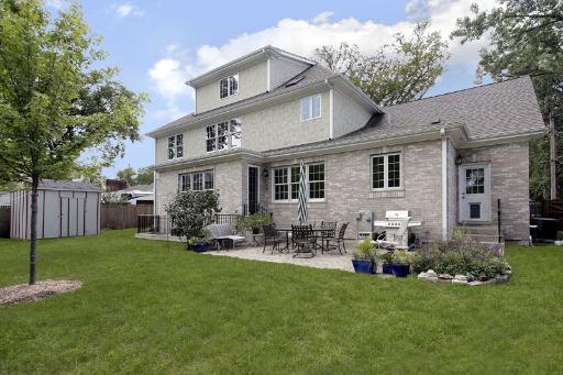 606 Locust Road Wilmette, IL 60091 - Photo 13 of 13 a backyard of a house with yard table and chairs