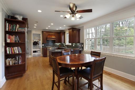 606 Locust Road Wilmette, IL 60091 - Photo 5 of 13 a view of a dining room with furniture window and wooden floor