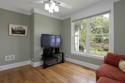 606 Locust Road Wilmette, IL 60091 - Photo 6 of 13 a living room with furniture and a flat screen tv