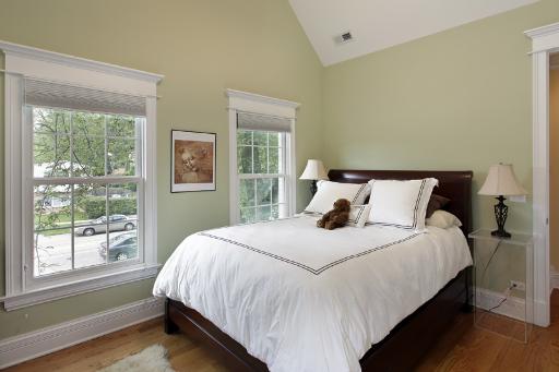 606 Locust Road Wilmette, IL 60091 - Photo 10 of 13 a large bed sitting in a bedroom next to a window