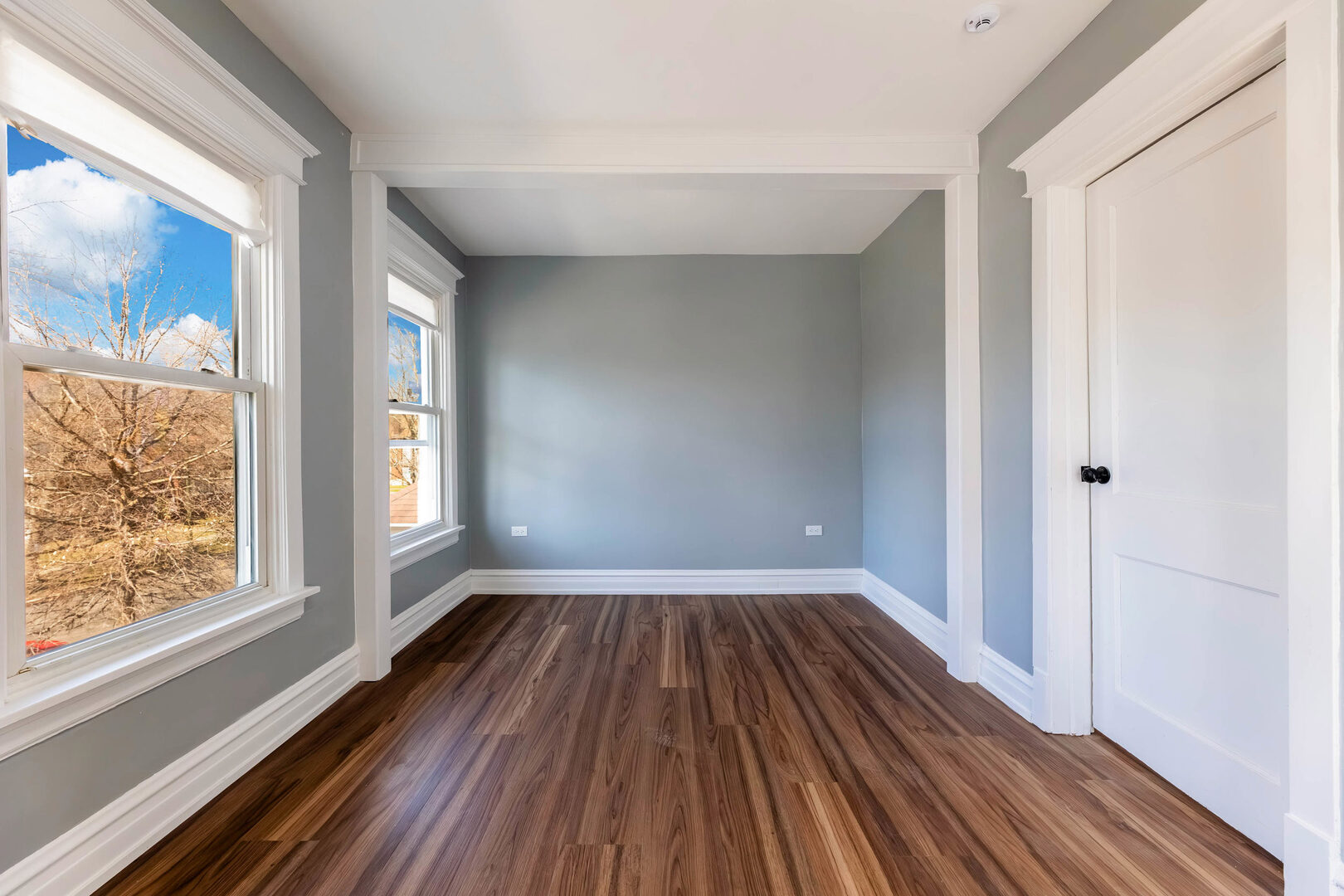 8817 South Morgan Street Chicago, IL 60620 - Photo 17 of 37 a view of empty room with wooden floor and fan