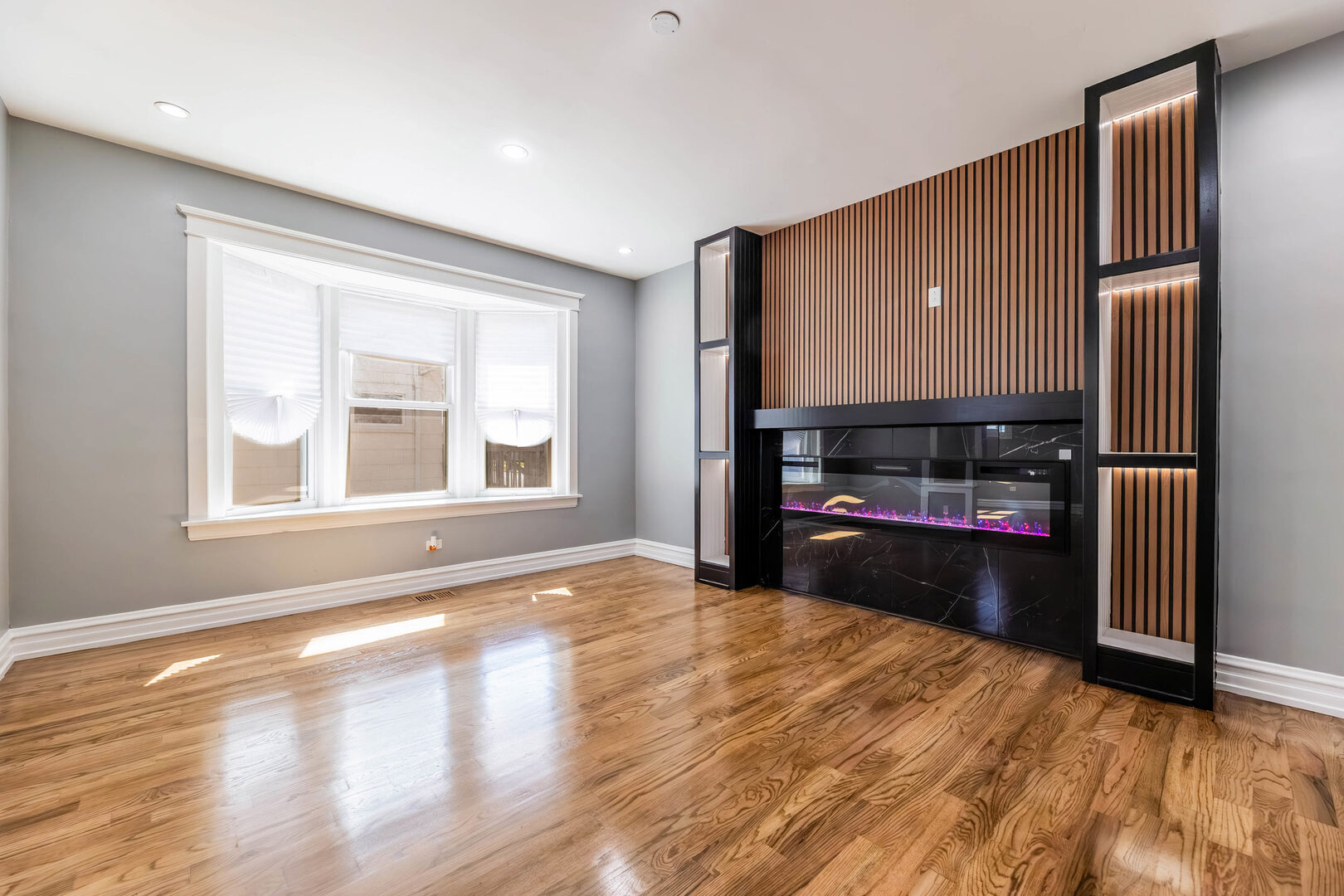 8817 South Morgan Street Chicago, IL 60620 - Photo 2 of 37 a view of an empty room with window and wooden floor