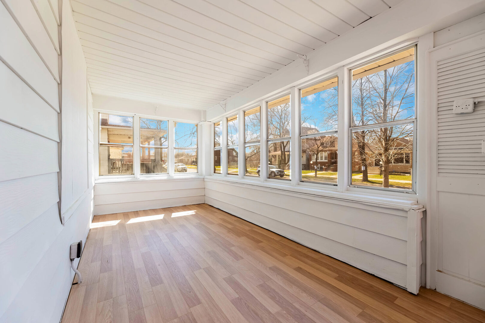 8817 South Morgan Street Chicago, IL 60620 - Photo 30 of 37 a view of an empty room with wooden floor and a window