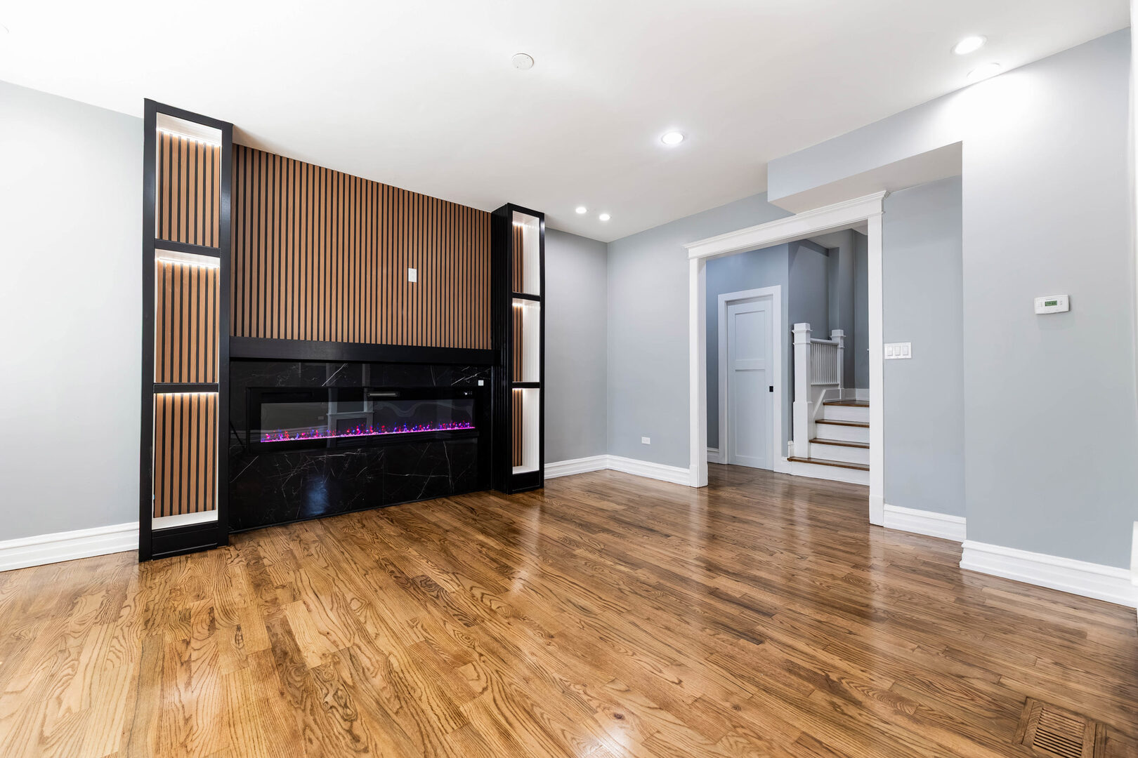 8817 South Morgan Street Chicago, IL 60620 - Photo 5 of 37 a view of kitchen and empty room with wooden floor