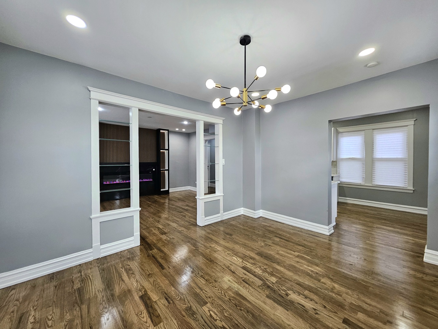 8817 South Morgan Street Chicago, IL 60620 - Photo 7 of 37 a view of an empty room with wooden floor and door