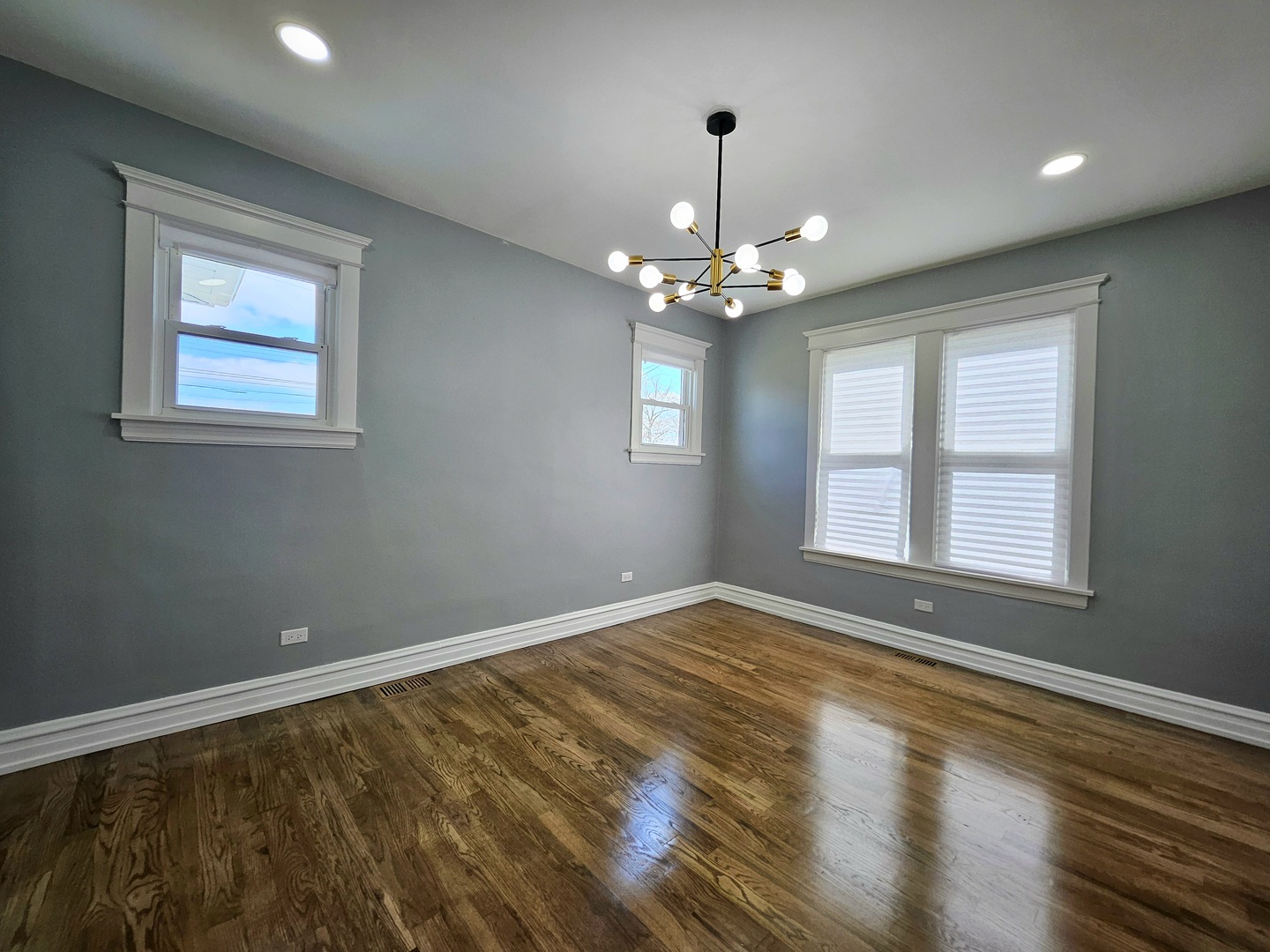 8817 South Morgan Street Chicago, IL 60620 - Photo 8 of 37 a view of an empty room with wooden floor and a window