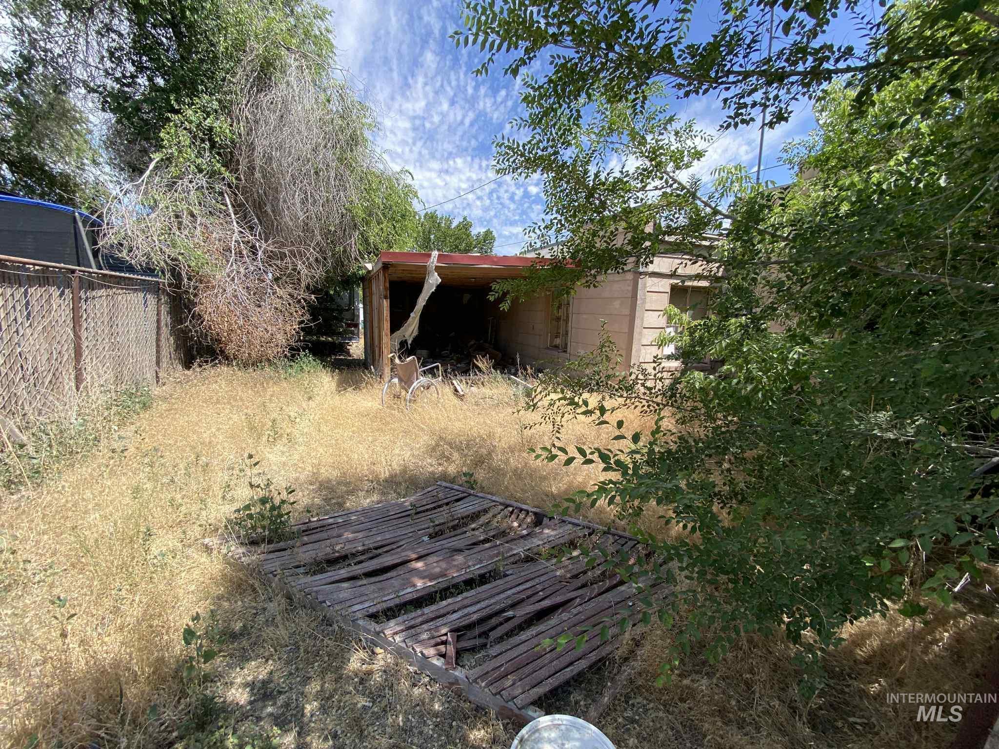 616 Main Street Filer, ID 83328 - Photo 2 of 12 View of yard with an outdoor structure