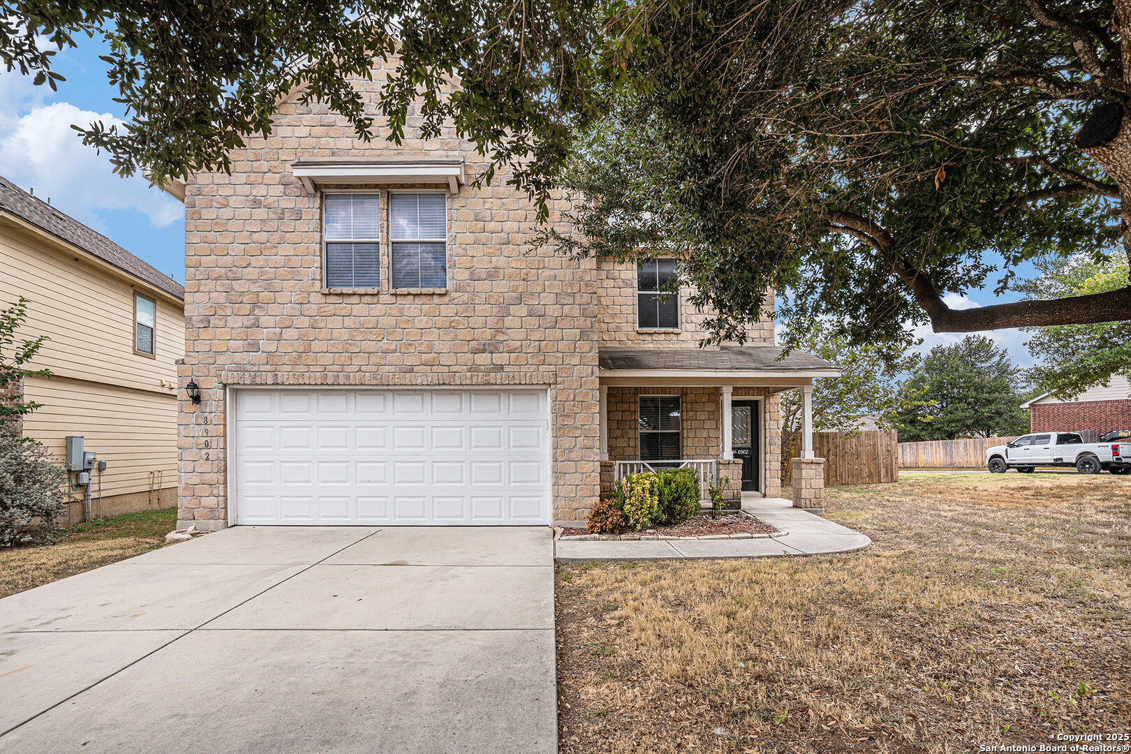 8902 Olmstead Park Converse, TX 78109 - Photo 1 of 1 a front view of a house with garden