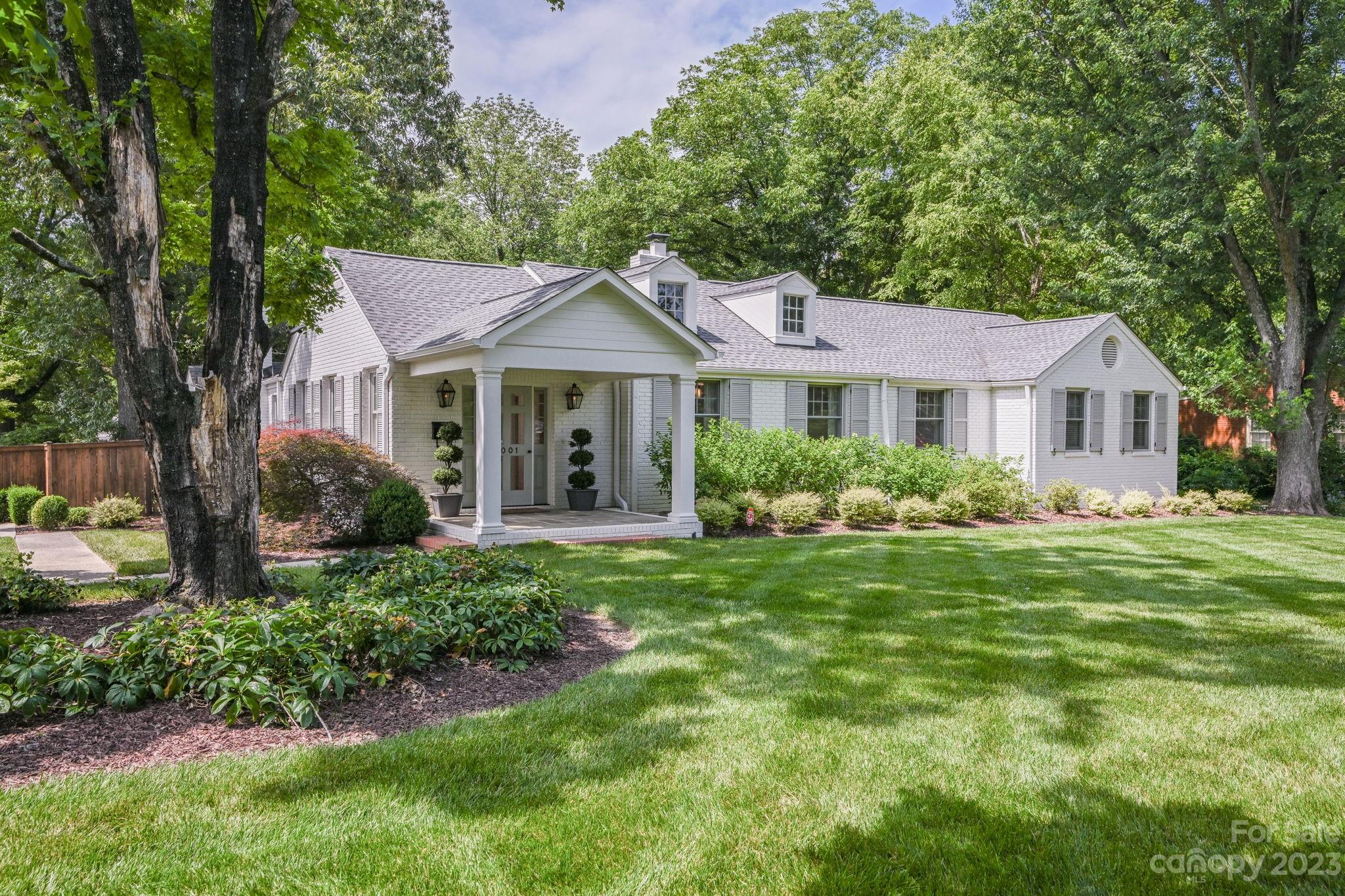 1001 Sedgefield Road Charlotte, NC 28209 - Photo 1 of 30 a front view of a house with a yard
