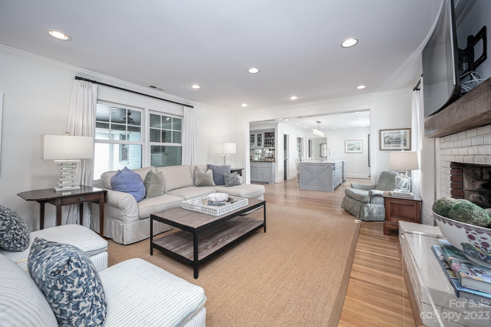 1001 Sedgefield Road Charlotte, NC 28209 - Photo 11 of 30 a living room with fireplace furniture and a rug