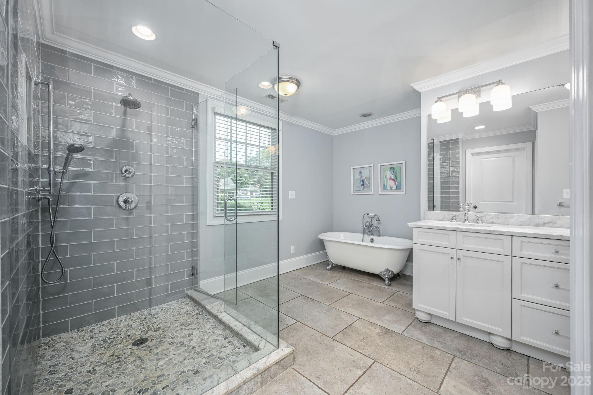 1001 Sedgefield Road Charlotte, NC 28209 - Photo 15 of 30 a spacious bathroom with sink shower and mirror