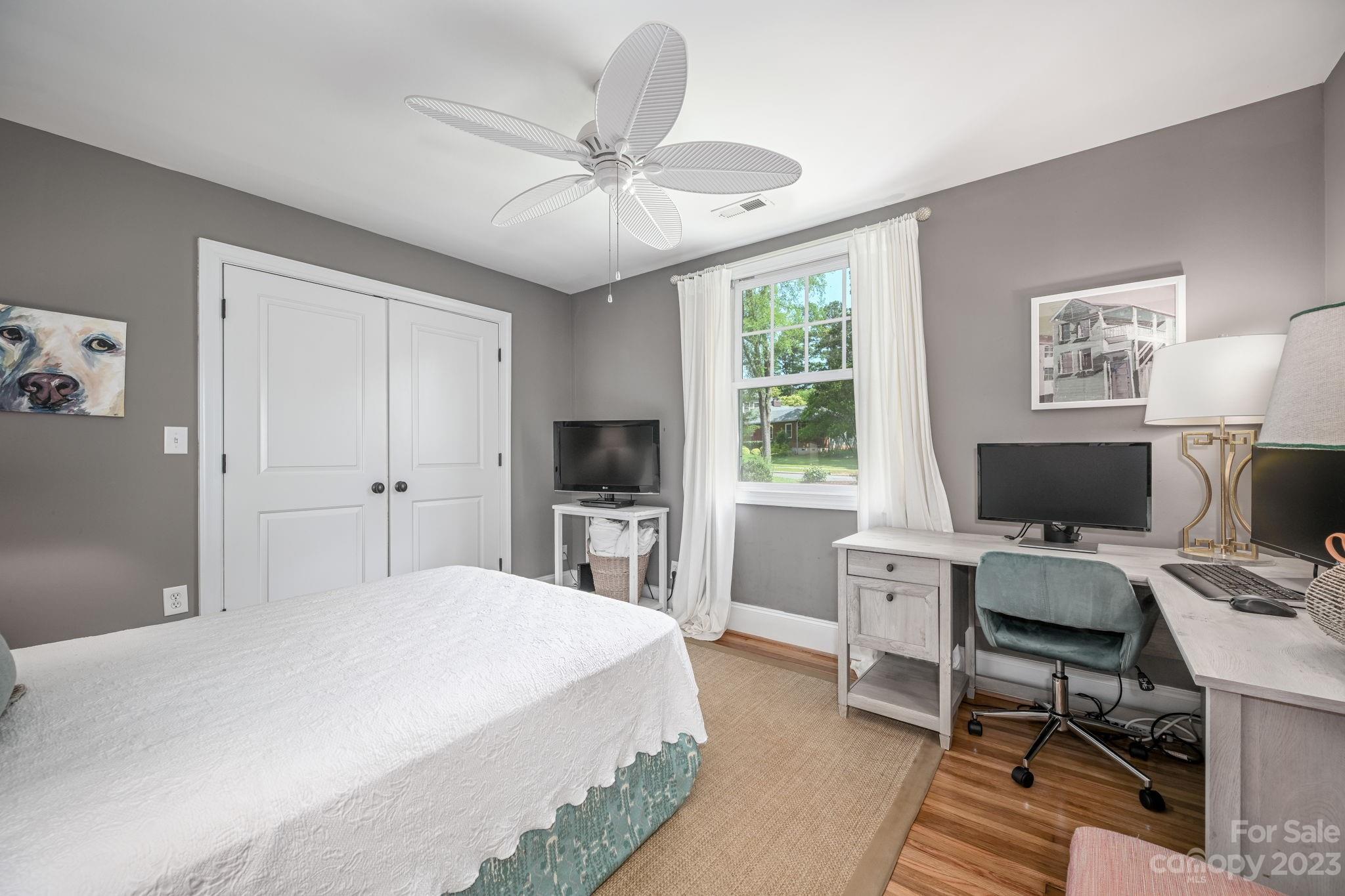 1001 Sedgefield Road Charlotte, NC 28209 - Photo 22 of 30 a bedroom with a bed and a desk