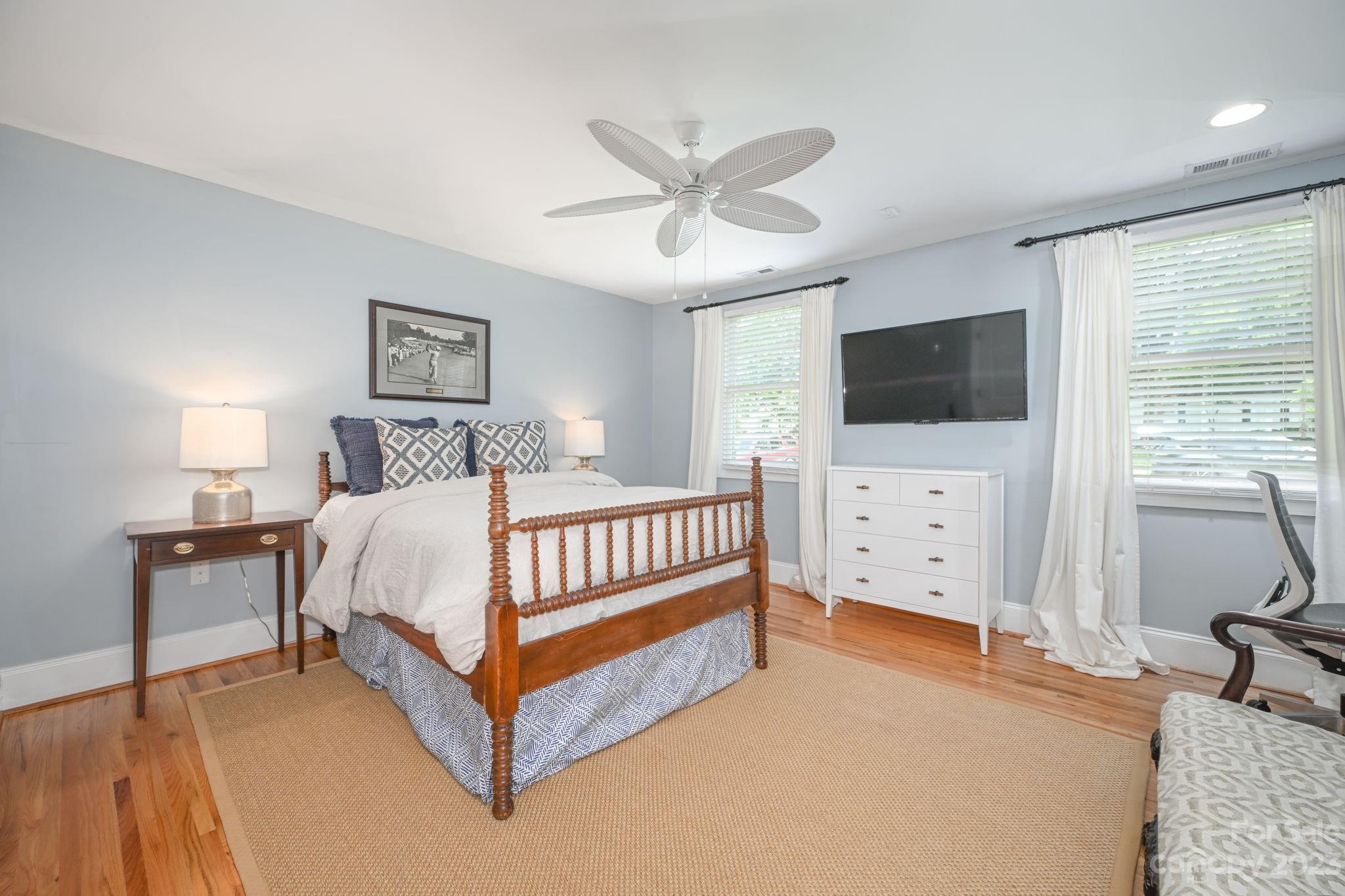 1001 Sedgefield Road Charlotte, NC 28209 - Photo 23 of 30 a bedroom with a bed and a flat screen tv