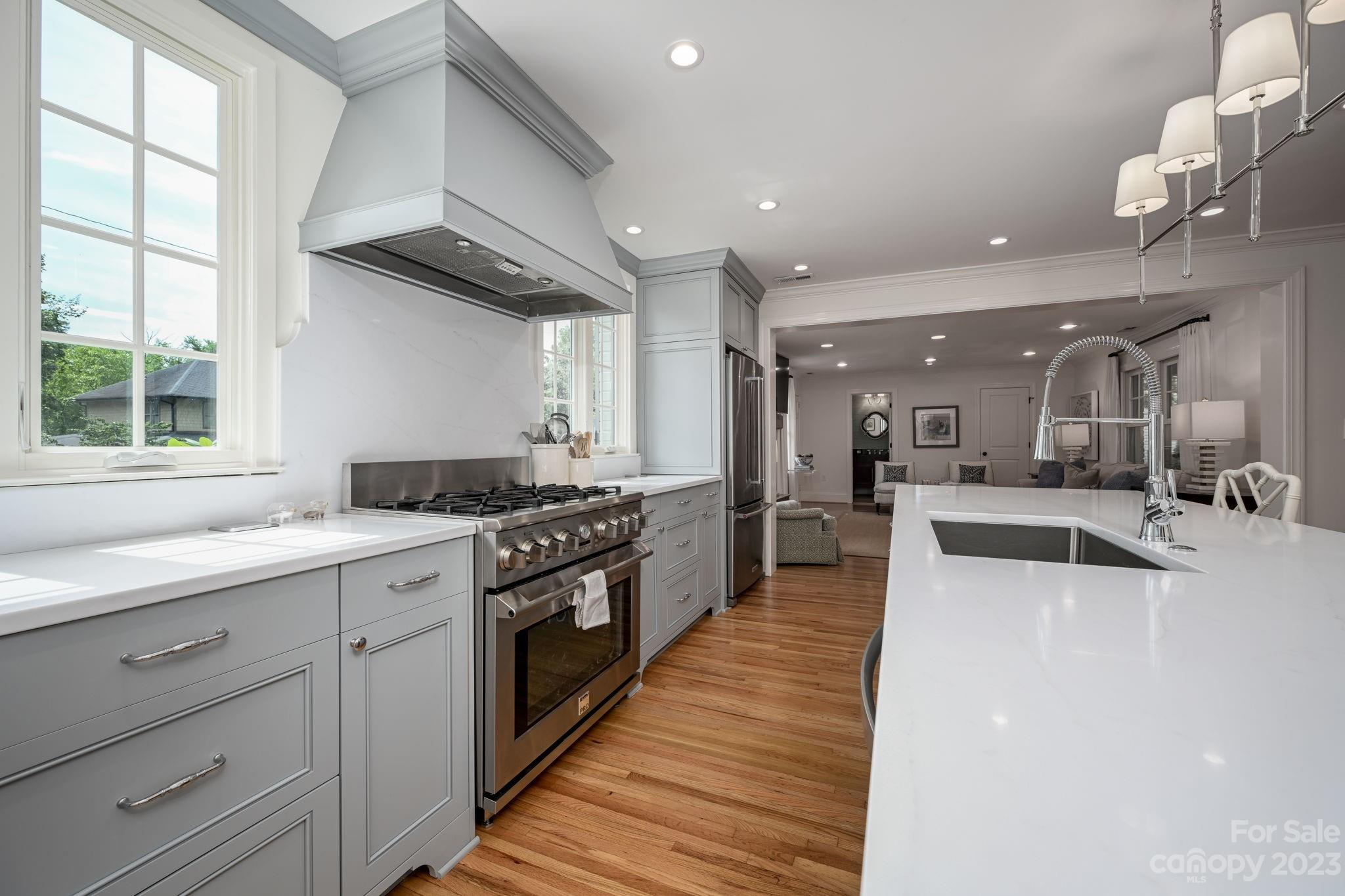1001 Sedgefield Road Charlotte, NC 28209 - Photo 7 of 30 a large kitchen with granite countertop a large counter top appliances and cabinets
