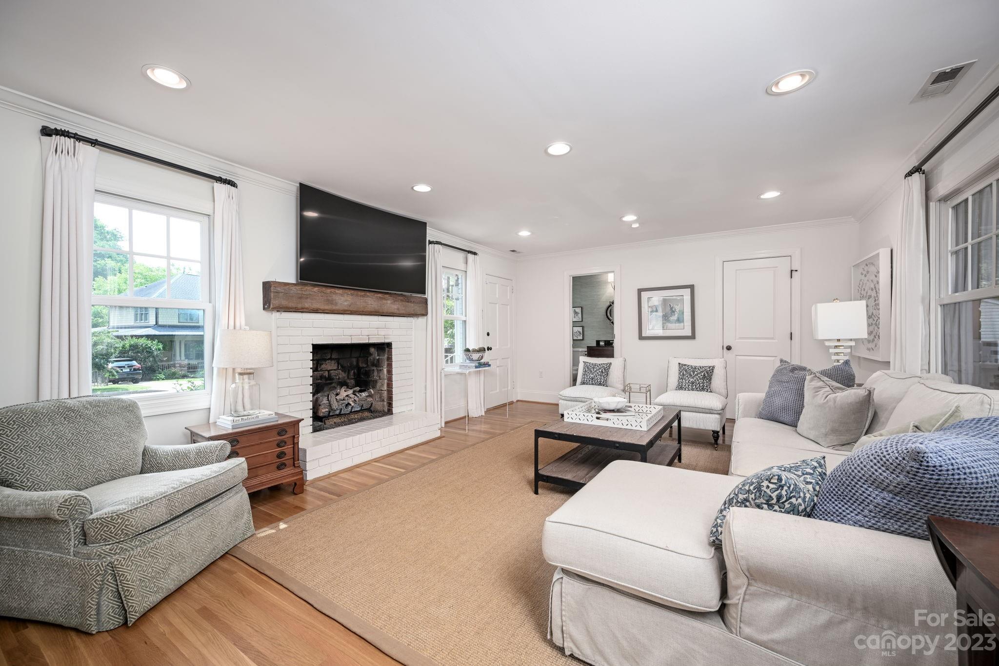 1001 Sedgefield Road Charlotte, NC 28209 - Photo 10 of 30 a living room with furniture fireplace and flat screen tv