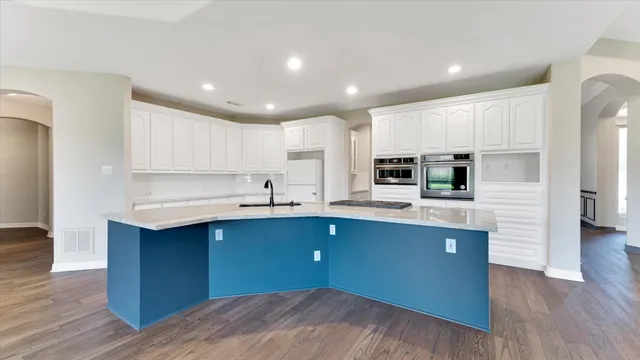 a kitchen with wooden cabinets and sink