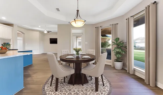 a view of a dining room with furniture window and wooden floor
