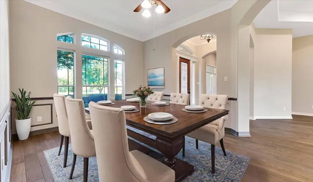 a view of a dining room with furniture window and wooden floor