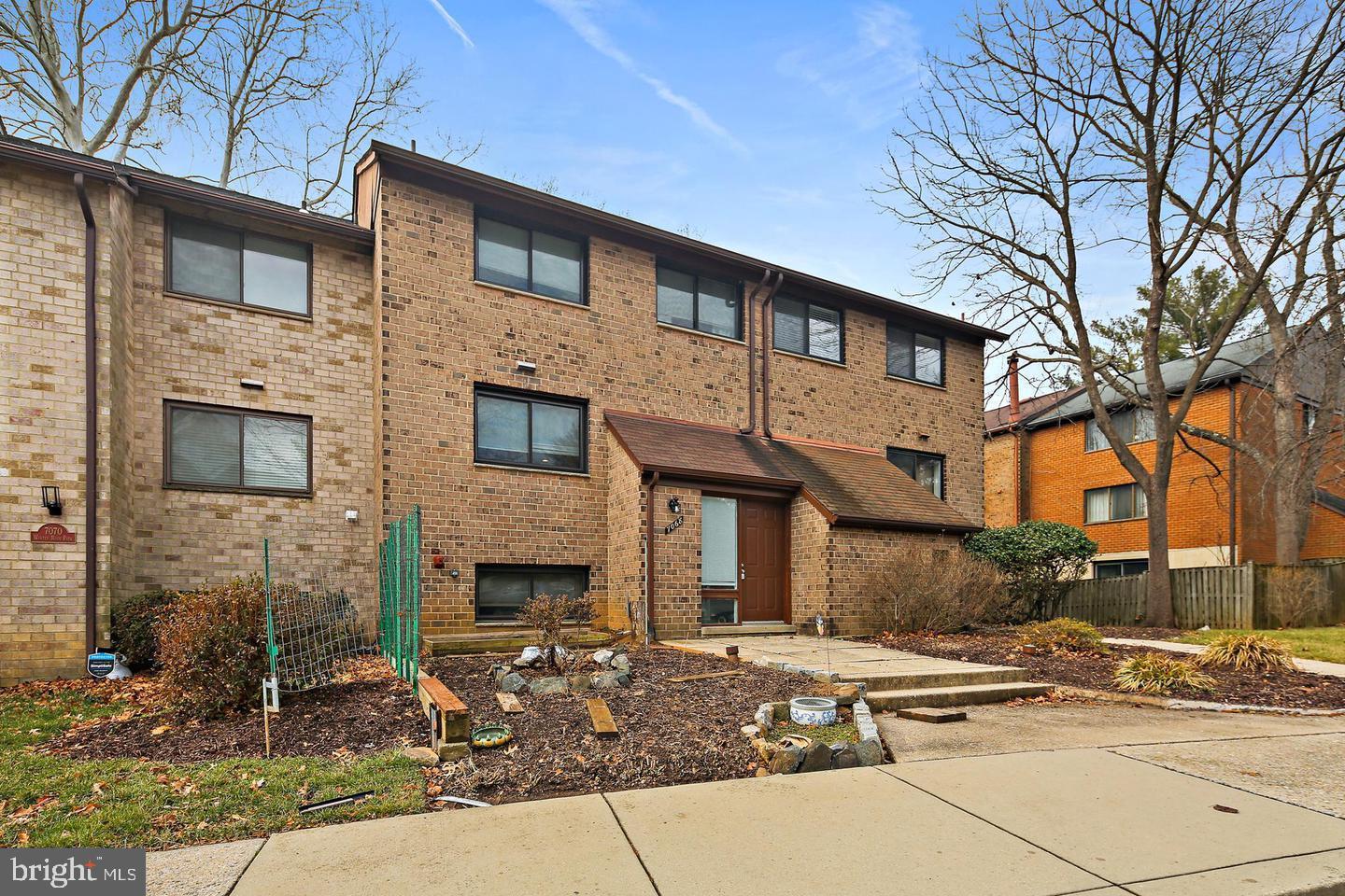 7068 Winter Rose Path Columbia, MD 21045 - Photo 1 of 30 a front view of a house with a yard