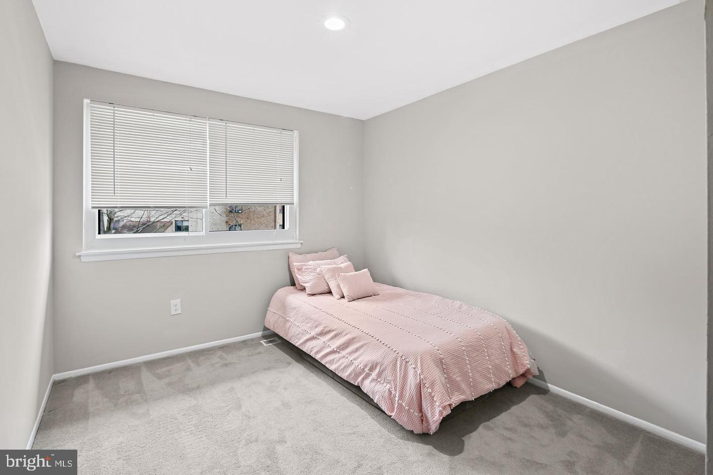 7068 Winter Rose Path Columbia, MD 21045 - Photo 19 of 30 a bedroom with a bed and window