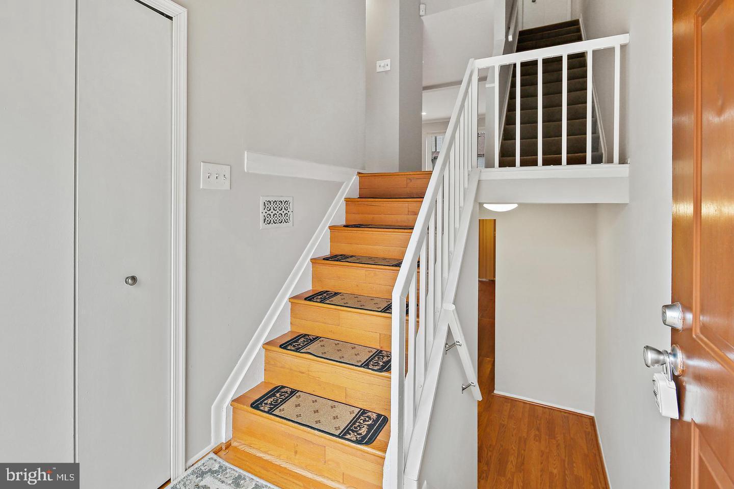 7068 Winter Rose Path Columbia, MD 21045 - Photo 2 of 30 a view of an entryway with wooden floor