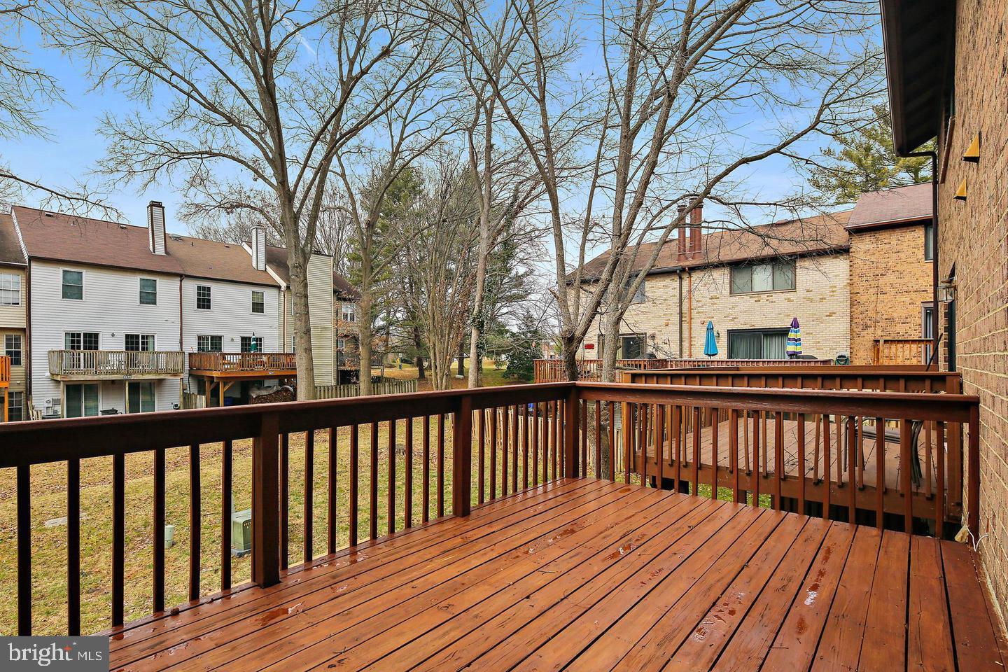 7068 Winter Rose Path Columbia, MD 21045 - Photo 27 of 30 a view of wooden deck with a trees