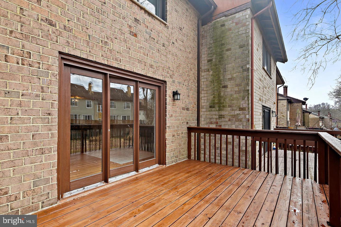 7068 Winter Rose Path Columbia, MD 21045 - Photo 28 of 30 a view of wooden balcony with a large window