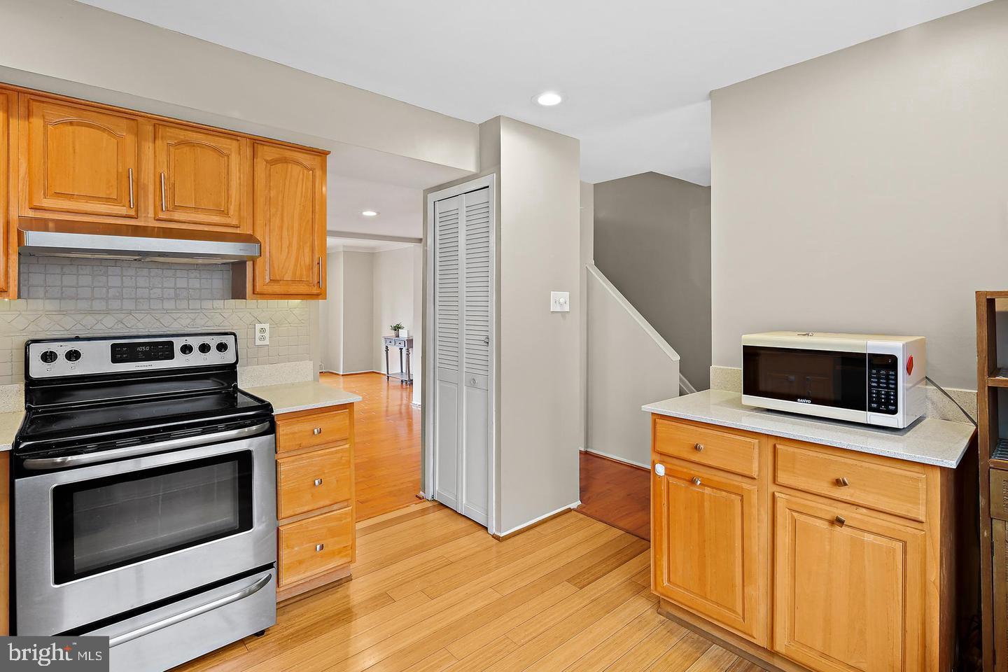 7068 Winter Rose Path Columbia, MD 21045 - Photo 7 of 30 a kitchen with a stove microwave and refrigerator