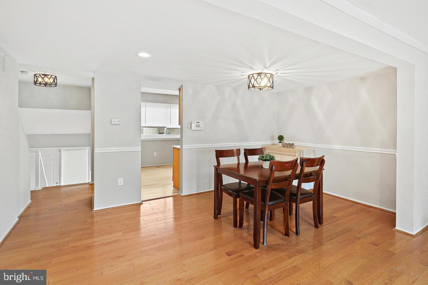 7068 Winter Rose Path Columbia, MD 21045 - Photo 9 of 30 a view of a dining room with furniture