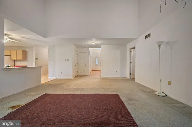 a kitchen with kitchen island a stove a sink and a refrigerator