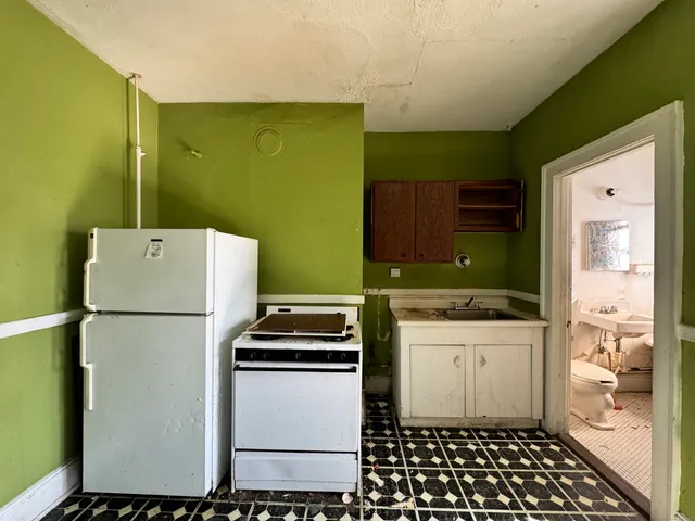 a utility room with a sink washer and dryer