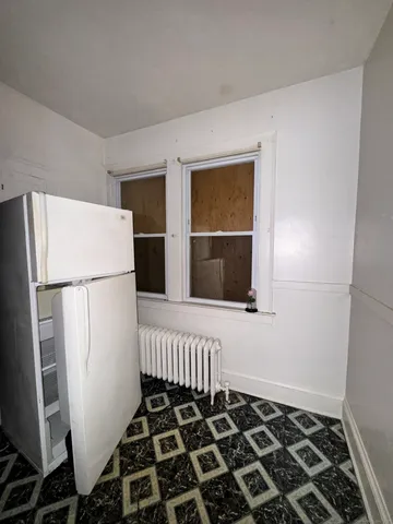 a front view of a house with many windows