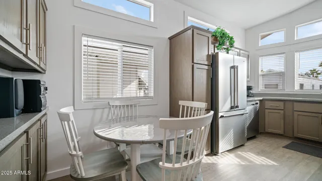 a view of a dining room with furniture and window
