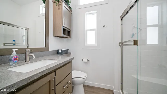 a view of a patio with table and chairs and potted plants