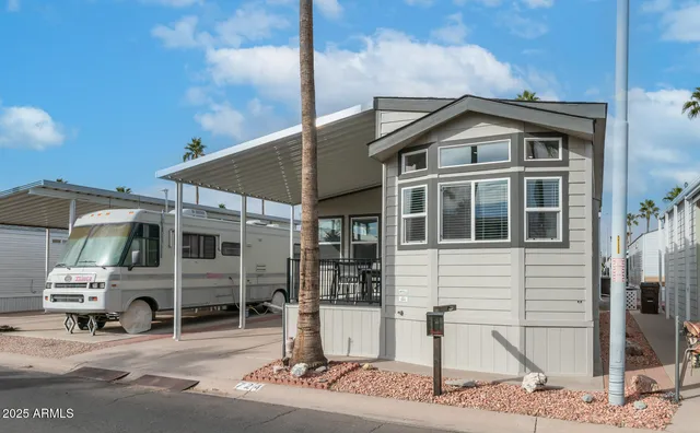 a view of a patio with couches chairs and potted plants