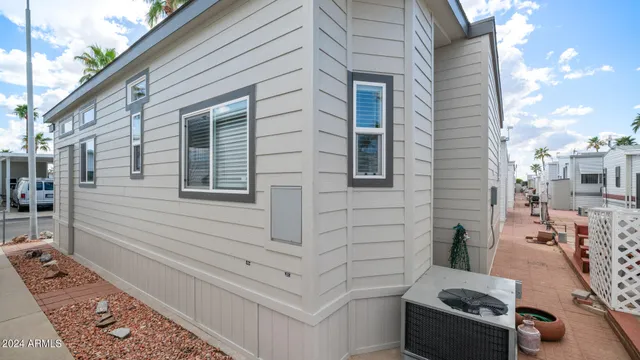 a room with a wooden table and chairs