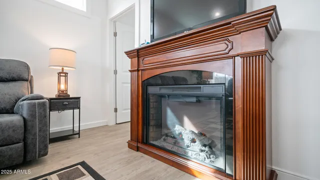 a living room with furniture and a kitchen