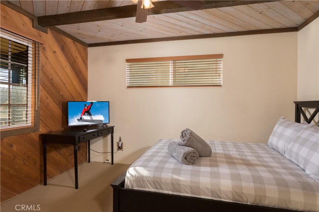 43014 Moonridge Road Big Bear Lake, CA 92315 - Photo 17 of 22 a bedroom with a bed and a desk