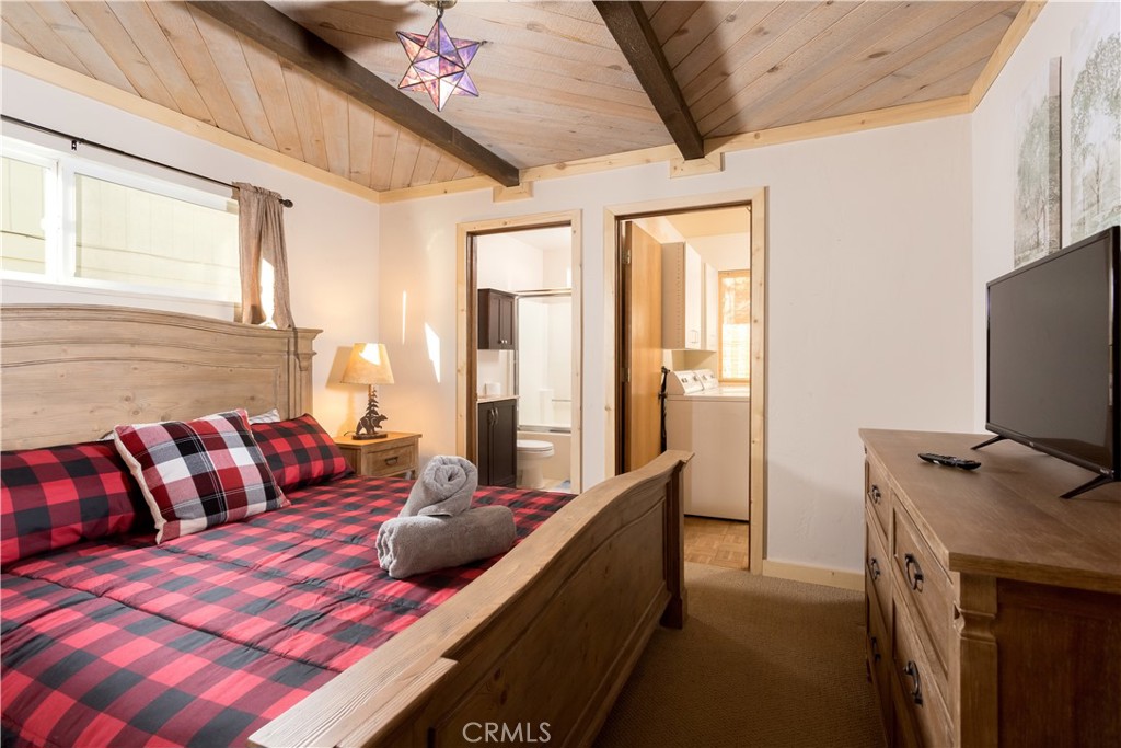 43014 Moonridge Road Big Bear Lake, CA 92315 - Photo 19 of 22 a bedroom with furniture and a flat screen tv